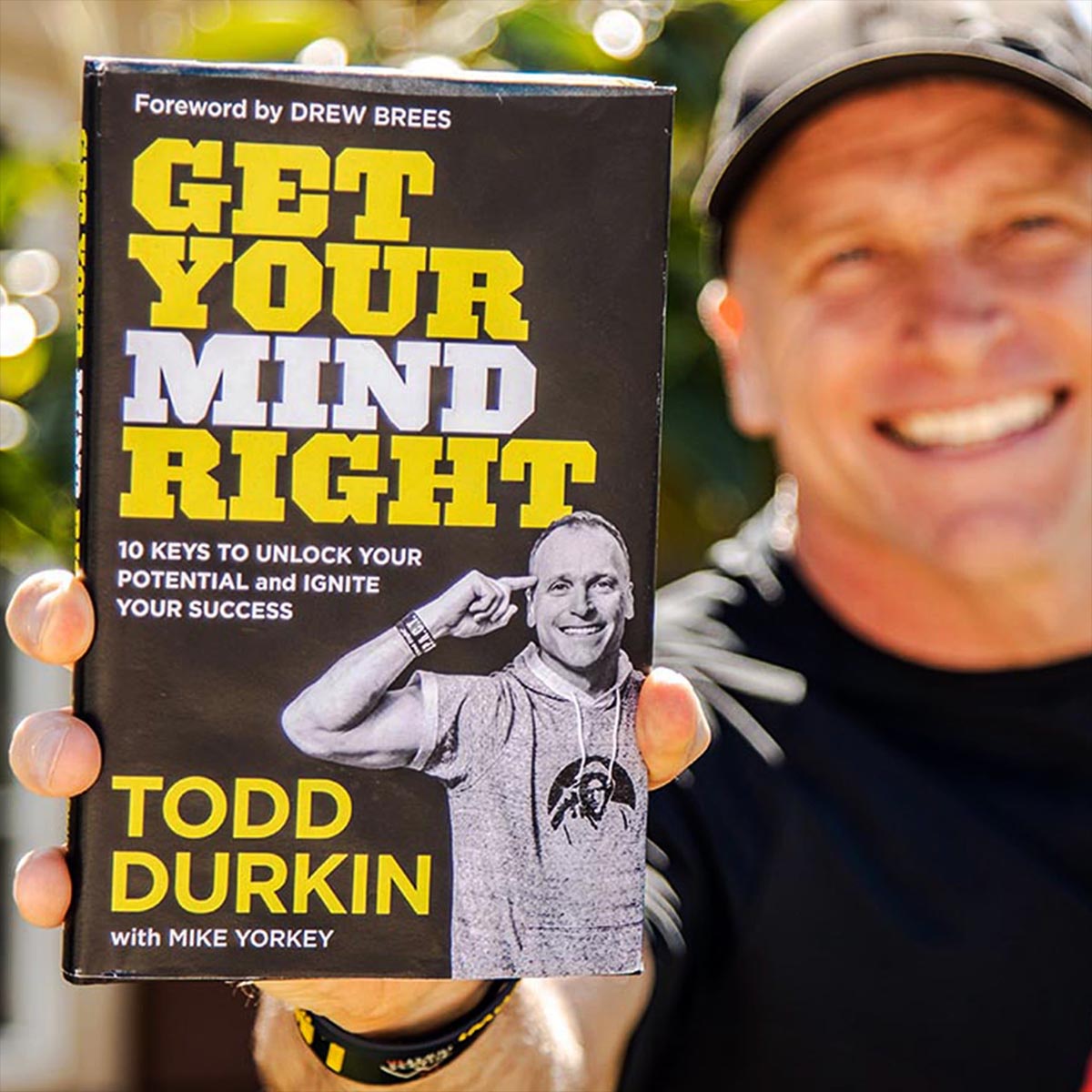 Todd Durkin holding his best-selling book Get Your Mind Right